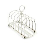 An Edwardian silver seven-bar toast rack, by Heath and Middleton, London 1903, rounded rectangular
