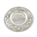 By W. Connell, a late-Victorian silver Arts and Crafts dish, London 1896, circular form, with