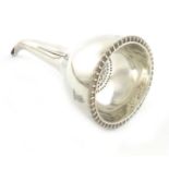 A George IV silver wine funnel, by John E. Terrey, London 1820, circular form, gadroon border,