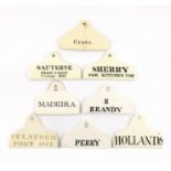 A collection of eight 19th century ceramic bin labels, coat hanger form, titled, 'SAUTERNE FROM