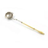 λA George II silver punch ladle, maker's mark worn, London 1742, shaped oval bowl, bifurcated joint,