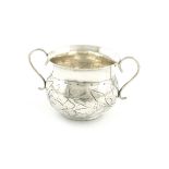 A Charles II silver porringer, maker's mark only ?P, baluster form, chased foliate decoration,