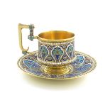 A late 19th century Russian silver-gilt and enamel cup and saucer, maker's mark M.T, possibly for M.