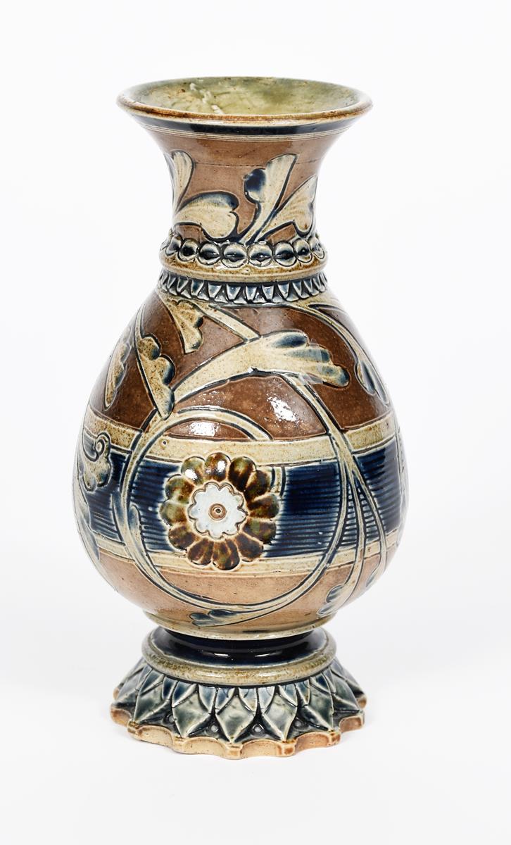 An early Martin Brothers stoneware vase by Robert Wallace Martin, ovoid with flaring rim, on