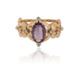 An amethsyt and diamond-set gold bangle, set with a large oval-shaped amethyst and six graduated