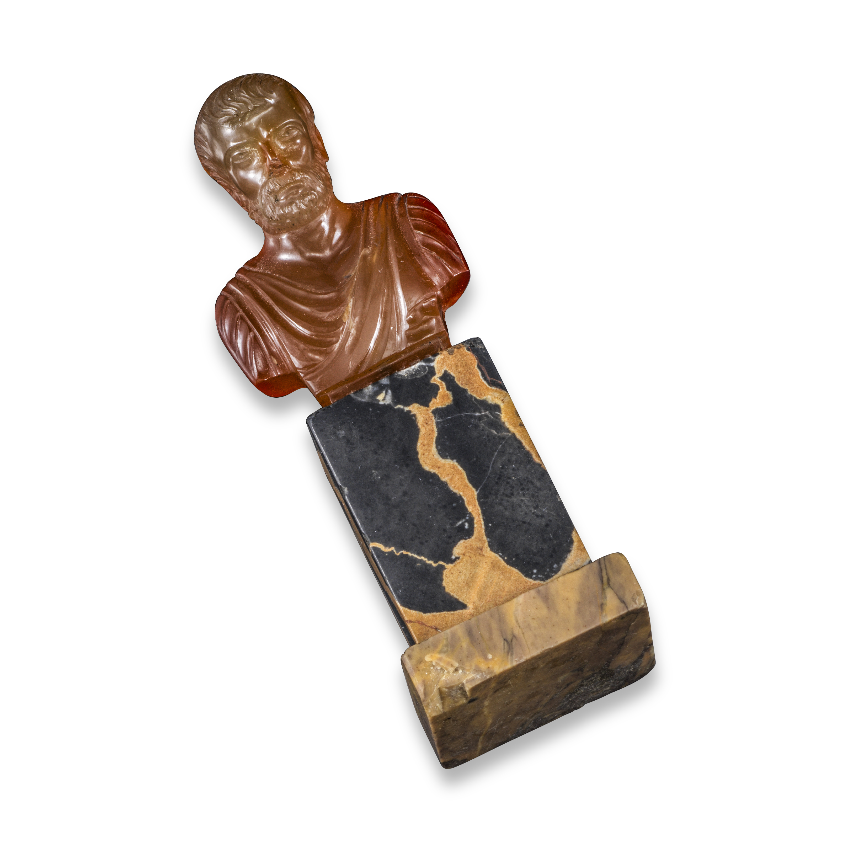 A mid 17th century carved agate bust, probably depicting a Roman Senator wearing robes, on a