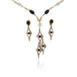 An abstract onyx, diamond and rock crystal necklace, set with fluted beads separated with fancy