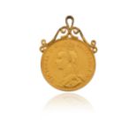 A two pound coin gold pendant, the coin dated 1887, with scrolling gold upper section, 4.2cm high,