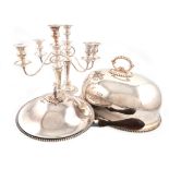 A mixed lot of electroplated items, comprising: a pair of three-light candelabra, of tapering