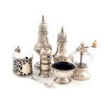 λA mixed lot of silver condiments, comprising: a Victorian silver-mounted glass pepper mill, the