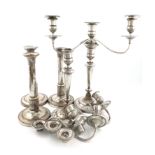 A set of three George III old Sheffield plated candlesticks, circa 1790, tapering columns, fluted