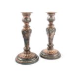 A pair of early 19th century old Sheffield plated candlesticks, circa 1830, tapering form,