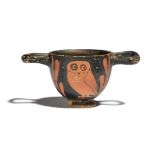 A Greek miniature red-figure owl skyphos South Italian, circa 4th century BC decorated with an owl