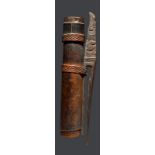 A Dayak quiver Indonesia bamboo with a cover and a carved wood belt hook decorated a bird's head and