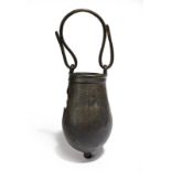 An Egyptian bronze situla circa 7th - 6th century BC the ovoid body with a knopped base and swing