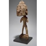 A Korvar figure fragment Irian Jaya, Indonesia 51cm high, on a stand. (2)