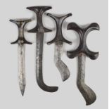 Three Hadendoa knives Sudan with carved double C shaped handles and shaped steel blades, the smaller