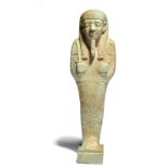 An Egyptian faience shabti Late Period, circa 664 - 332 BC with a tripartite grooved wig and false