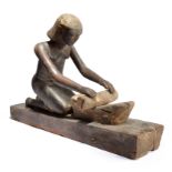 An Egyptian kneeling female figure grinding Middle Kingdom, circa 2000 BC with ribbed hair and