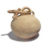 A Persian pottery zoomorphic spouted jar circa early 1st millennium BC with a globular body and a