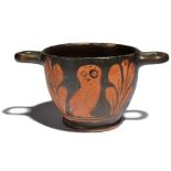 A Greek red-figure owl skyphos South Italian, circa 4th century BC decorated with an owl and