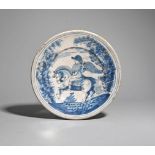 A Spanish maiolica charger 18th century, painted in blue and black with a winged figure on horseback