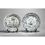 Two delftware chargers c.1720-40, probably London, one boldly decorated in red, blue and green