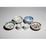 Four faïence and maiolica small bowls probably 17th century and later, one decorated in the 16th