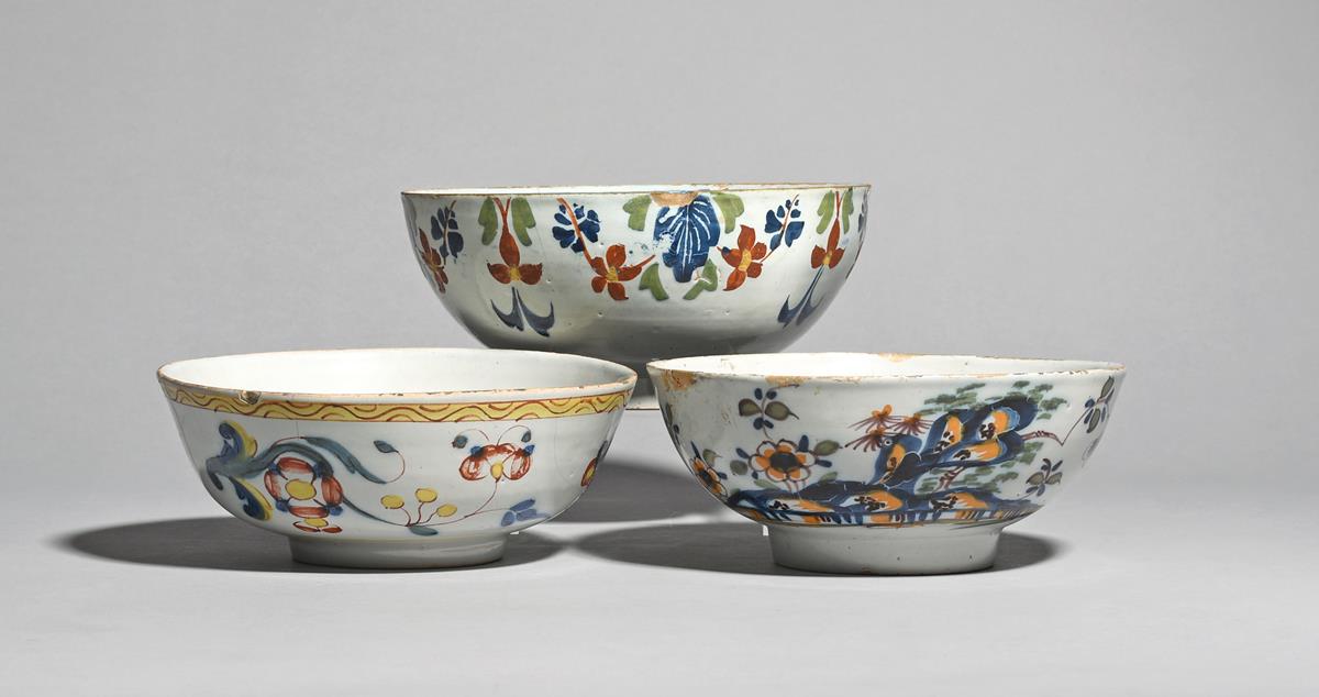 Three delftware bowls c.1740-60, probably London, one painted in bright enamels with flying