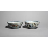 A pair of delftware slop bowls c.1740, each painted in polychrome enamels with a long-tailed