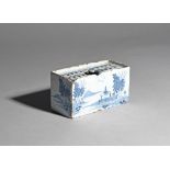 A delftware flower brick c.1760, the rectangular form painted in blue with low huts beneath trees in