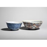 Two delftware bowls c.1730-50, the smaller painted in blue to the exterior with overlapping
