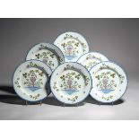 Six Lambeth delftware plates c.1780-90, painted in green, manganese and blue with a bunch of
