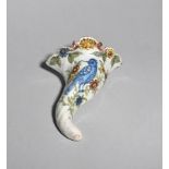 A Liverpool delftware wall pocket c.1760, of cornucopia shape, moulded with a large bird picked