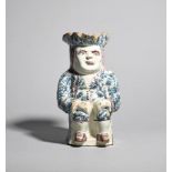 A Delft Toby jug c.1770, seated on a low box with his hands resting on his knees, wearing a