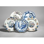 Five delftware plates mid 18th century, including a pair of plates painted in polychrome enamels
