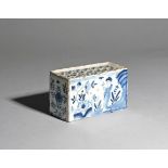 A delftware flower brick c.1750, possibly Lambeth, the rectangular form painted in blue to each long
