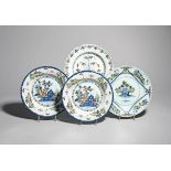 Four delftware plates c.1740-60, one Lambeth and painted in polychrome enamels with a jardiniere