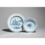 A Bristol delftware plate mid 18th century, painted in blue with small buildings and trees in an