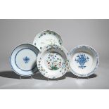 Four delftware bowls mid 18th century, the shallow forms variously decorated in blue and