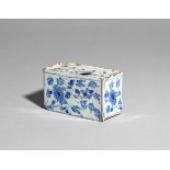 A small delftware flower brick c.1750, the rectangular form painted with flowering mimosa sprays