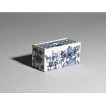 A small delftware flower brick c.1760, the rectangular form painted in shades of blue with flowering