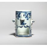 A London delftware food warmer base c.1760-80, the cylindrical form with a shaped opening beneath