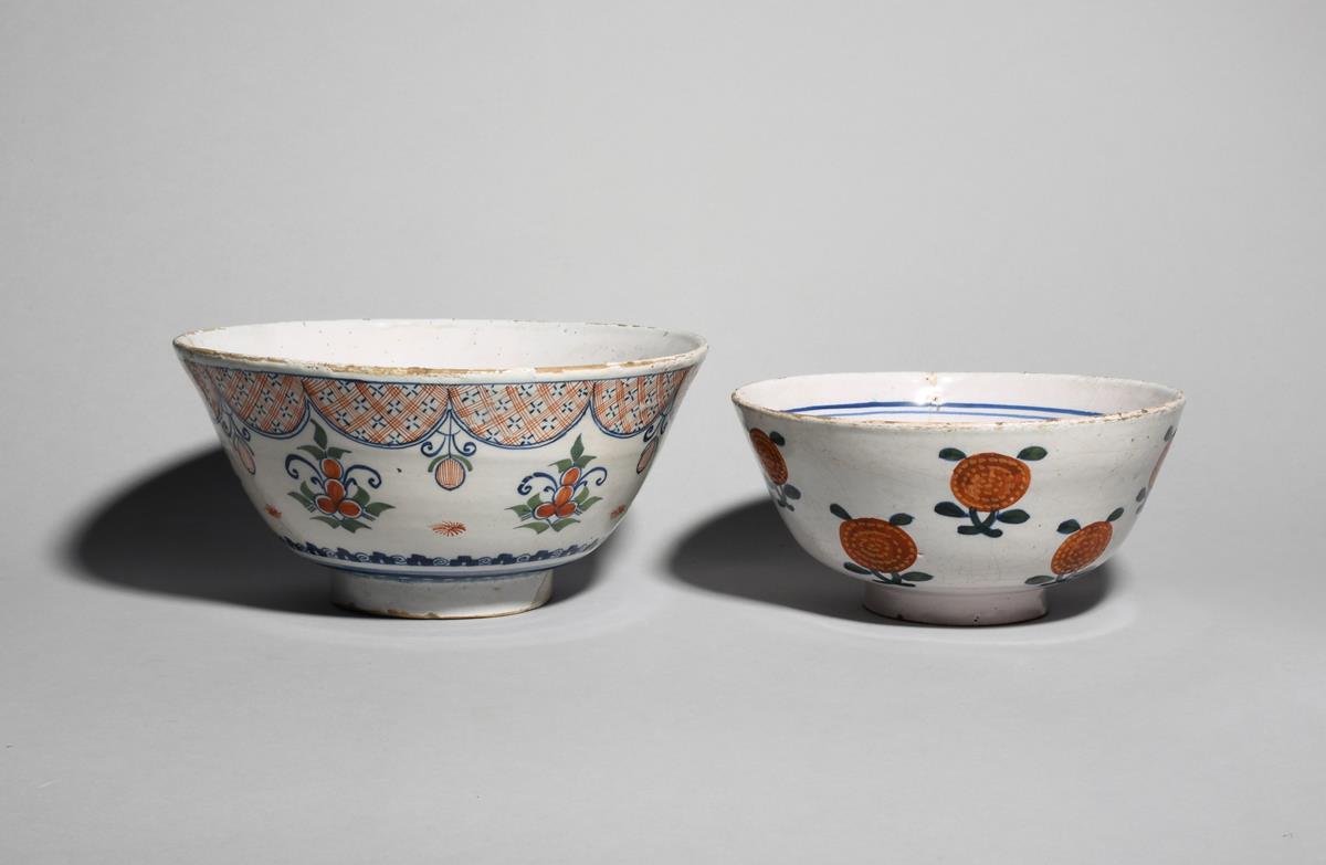 A delftware punch bowl c.1725-40, probably Bristol, the tall flared sides painted in red, blue and