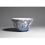 A large delftware punch bowl c.1725, probably Brislington, boldly decorated in blue, red and green