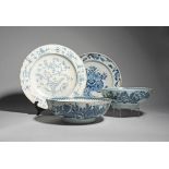 A large delftware charger and two punchbowls c.1740-80, the charger probably Liverpool and finely