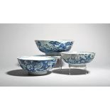 Three delftware bowls c.1760, in three sizes, all painted in blue, the largest with small huts