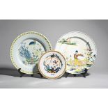 A London delftware charger and a plate c.1725-35, both decorated in polychrome enamels with a long-