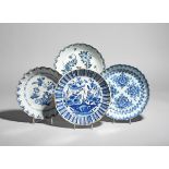 Four delftware shallow bowls c.1710-50, Lambeth and Bristol, two moulded with fluted and painted