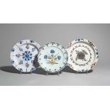 Three delftware plates c.1760-80, probably London, of simple shape, one painted in red, green and